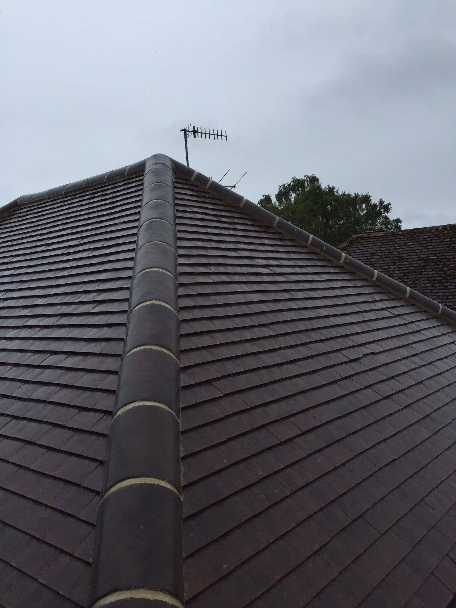 Close-up of new roof tiles and ridge